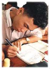 Photo: A student works diligently in a Bible class at the Wenzhou Lay Training Centre